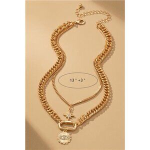 Layered gold chain necklace with eye and star